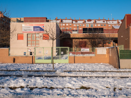 San SebastiÃ¡n de los Reyes, Madrid, Spain; 09-01-2021: Miguel Delibes school during a snowfall due to the storm Filomena, closed due to accumulation of snow and safety for schoolchildrenのeditorial素材