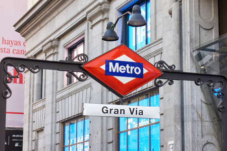 Madrid, Spain; 06-01-2022: Signage plate of the Madrid Gran Via metro station in front of the famous Telefonica buildingのeditorial素材