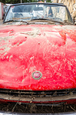 Villamanta, Madrid, Spain; 05-09-2023: Classic car Fiat 124 sport spider damaged by water and mud after a strong summer stormのeditorial素材