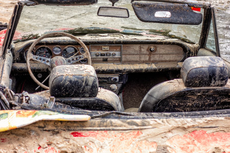 Villamanta, Madrid, Spain; 05-09-2023: Interior of a classic car Fiat 124 sport spider damaged by water and mud after a strong summer stormのeditorial素材