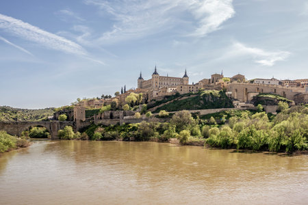 Panoramic view of Toledo with the AlcÃ¡zar fortress, the Tagus River, and the historic...