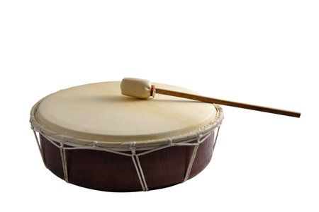 Wooden drum with a stick on a white background