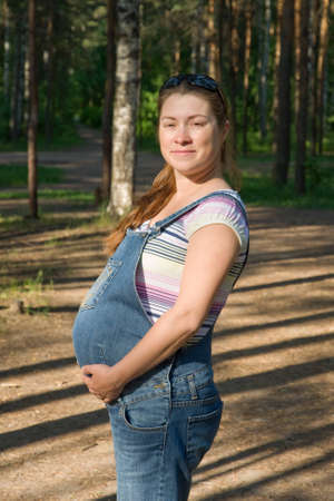 A pregnant woman to walk in the park. Sunny afternoonの写真素材
