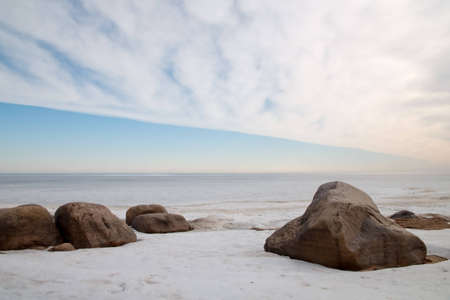 Boulders in the ice on the shore of Lake Ladogaの写真素材