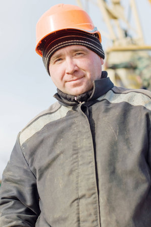 Portrait of a worker on a construction site protective helmetの写真素材