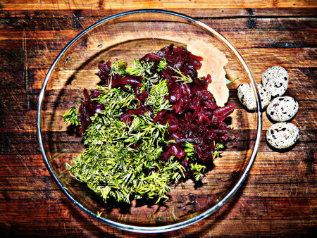 Salad of cooked beets with fresh dill with boiled quail eggsの写真素材