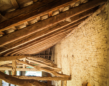 Truss sequence supporting roof of an old barn to open in a 18th century venetian villa