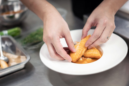 cooking in the kitchen, close up of female hands preparing food