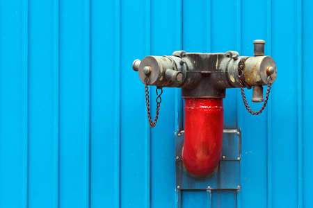 Red Fire Hydrants be side Blue Buildingの写真素材