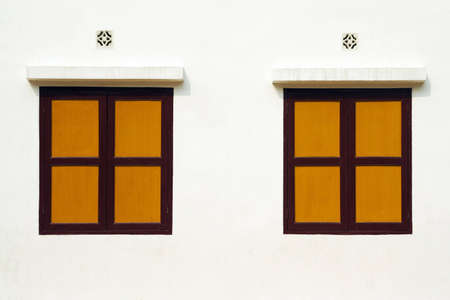 Yellow Wood Windows on white wallの写真素材
