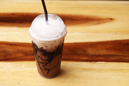ice Mocha coffee on wood floorの写真素材