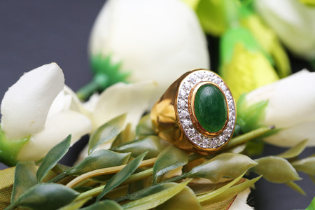 Jade on gold ring with diamondの写真素材