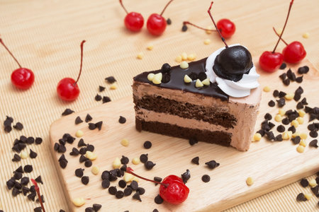 piece of chocolate cake and cherry