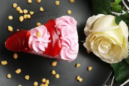Rose and strawberry jam topping on cake
