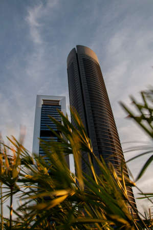 Modern skyscrapers with reflected sunset light in Madrid, Spain. Botton up Viewの写真素材
