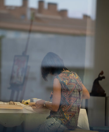 Young female painting at art studio, learning how to draw.の写真素材