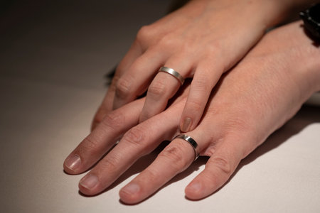 Just married couple holding hand with wedding rings.の写真素材