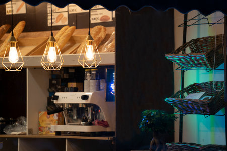 Modern cafe or bar with night lights and bread. Reflectionsの写真素材