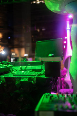 Dj cabin and computer on nightclub during partyの写真素材
