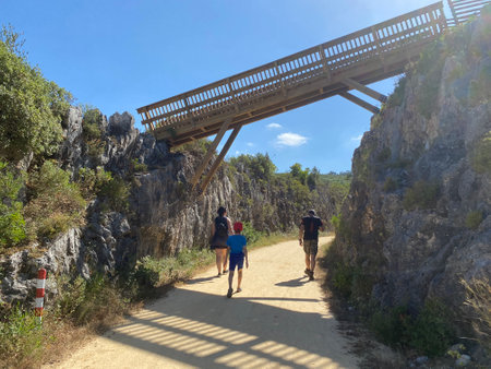 Family hiking on a natural park from portugal. Parents kid enjoying summer holidays in natureの写真素材