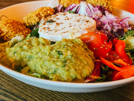 Close up of colorful salad over wooden tableの写真素材