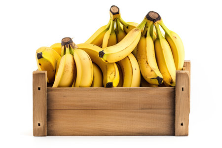 Wooden crate with bananas isolated on white backgroundの素材