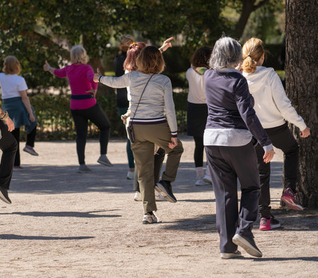 Elderly women enjoying outdoor fitness class, embracing active lifestyle and community engagement