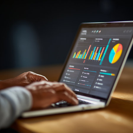 Person working with statistical data on laptop, analyzing financial charts and graphs, performing market analysisの写真素材