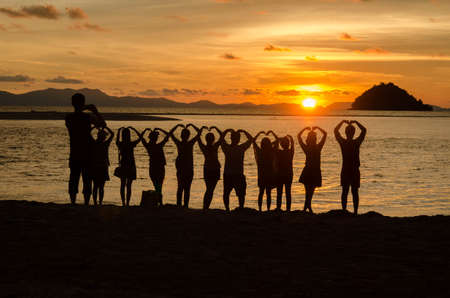 A heart symbol silhouette  by the sea and sunset, Thailandの写真素材