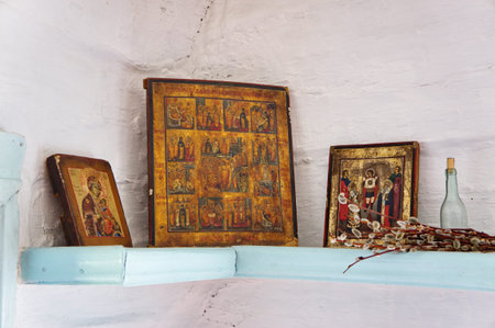 Ancient altar with three Christian icons and willow in the corner of Russian country house の写真素材