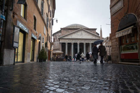 Rome Italy View of the Pantheon of Agrippa on Piazza della Rotonda from a cobbled street on a rainy day.のeditorial素材