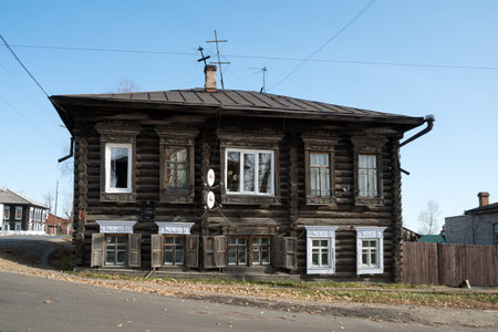 Two-story log house built in the 2 half of the 19th century, the Bolshevik Ada Lebedeva lived in it in 1905-1906, what is written on the table.のeditorial素材
