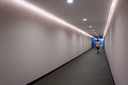 Long white passage leading to the football arena with people at the end at the Giuseppe Meazza or San Siro stadium, built in 1925.のeditorial素材