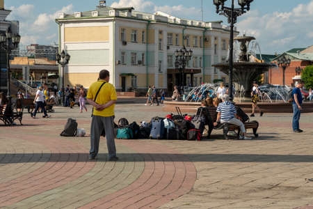 Krasnoyarsk, Krasnoyarsk Region, RF - July 19, 2021: pile of luggage stands on Privokzalnaya Square against the Prosecutor's Office background of the building of the West Siberian Transportのeditorial素材