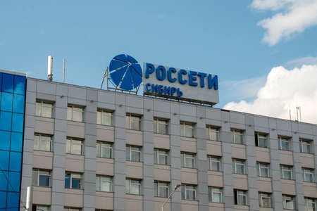 Krasnoyarsk, Krasnoyarsk Region, RF - July 19, 2021: logo and the name in Russian of the company - Rosseti Siberia - carrying out the transmission and distribution of electrical energy on the office.のeditorial素材
