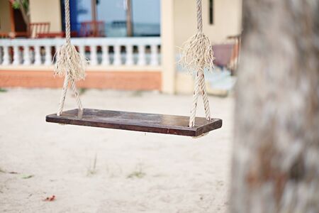 The wooden swing on the beach.の写真素材