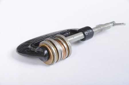 Clamp squeezing coinsの写真素材