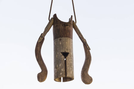 old wooden bamboo bell work by windの写真素材