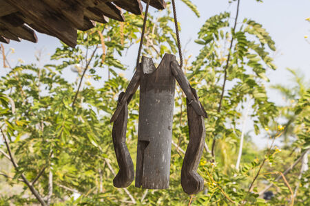 old wooden bamboo bell work by windの写真素材
