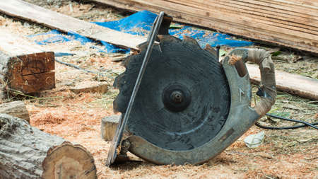 handyman cut wood with jigsaw in workshopの写真素材
