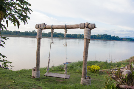 Empty swings on playgroundの写真素材