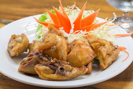 fried chicken with garlic and herbsの写真素材
