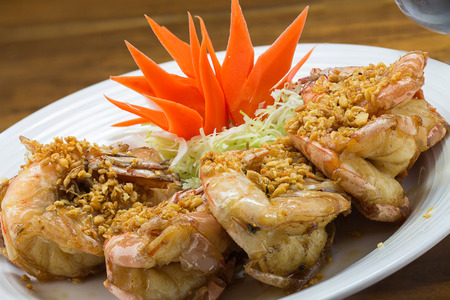 fried king prawns with garlic and herbsの写真素材