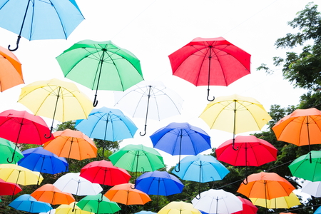 hanging colorful umbrellas background. Colorful umbrellas in the sky. Street decoration.の写真素材