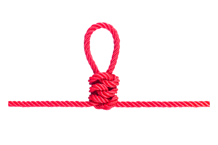 string of red rope knot isolated on white backgroundの写真素材