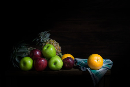 Still life of fruit  on wooden lighting from windowsの写真素材