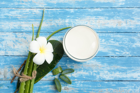 Spa fresh Aloe vera, Milk and flower on wood backgroundの写真素材
