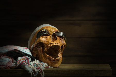 Halloween skull and glasses made by fork, still life style on woodenの写真素材