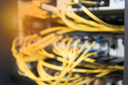 Blurred background. Fiber optical in network rack cabinetの写真素材