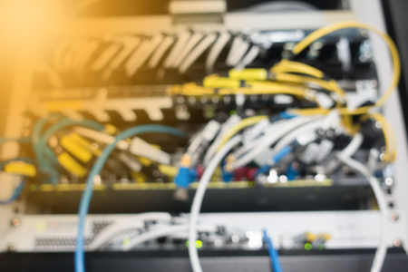 Blurred background. Fiber optical in network rack cabinetの写真素材
